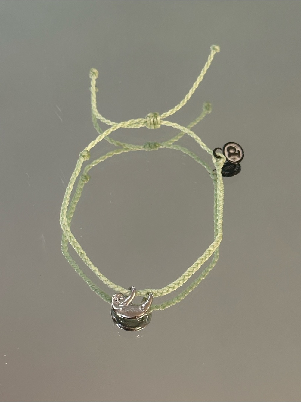 Pura Vida.  Light Green Braided Cord Bracelet with Silver Sloth Charm